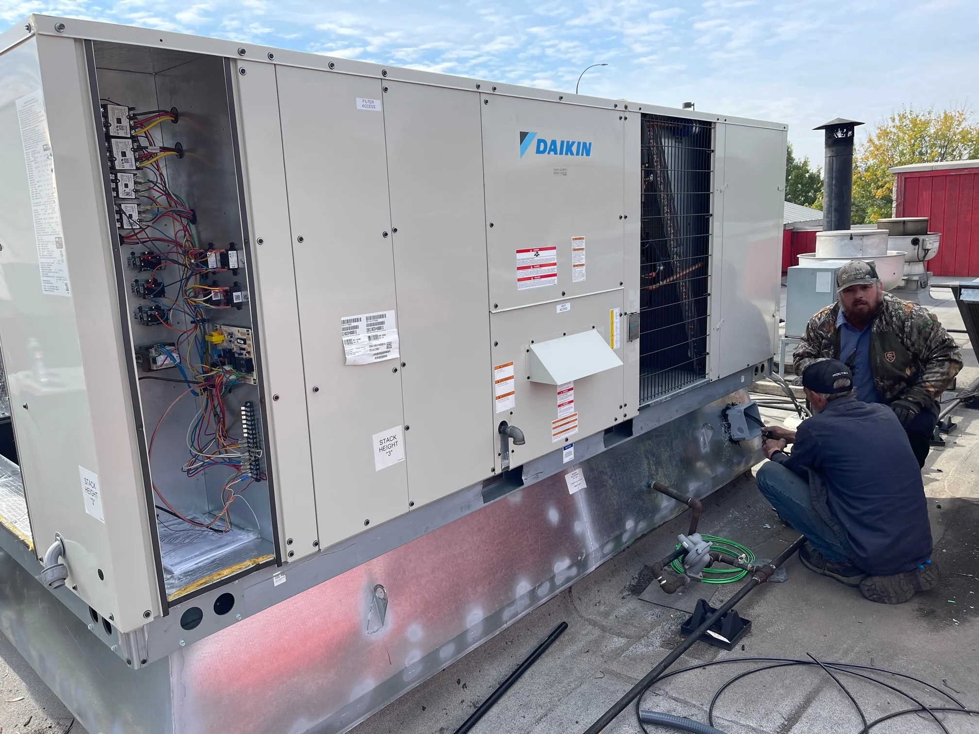 Installation of high voltage service disconnect on Daikin commercial gas package unit installation in Arlington, Texas