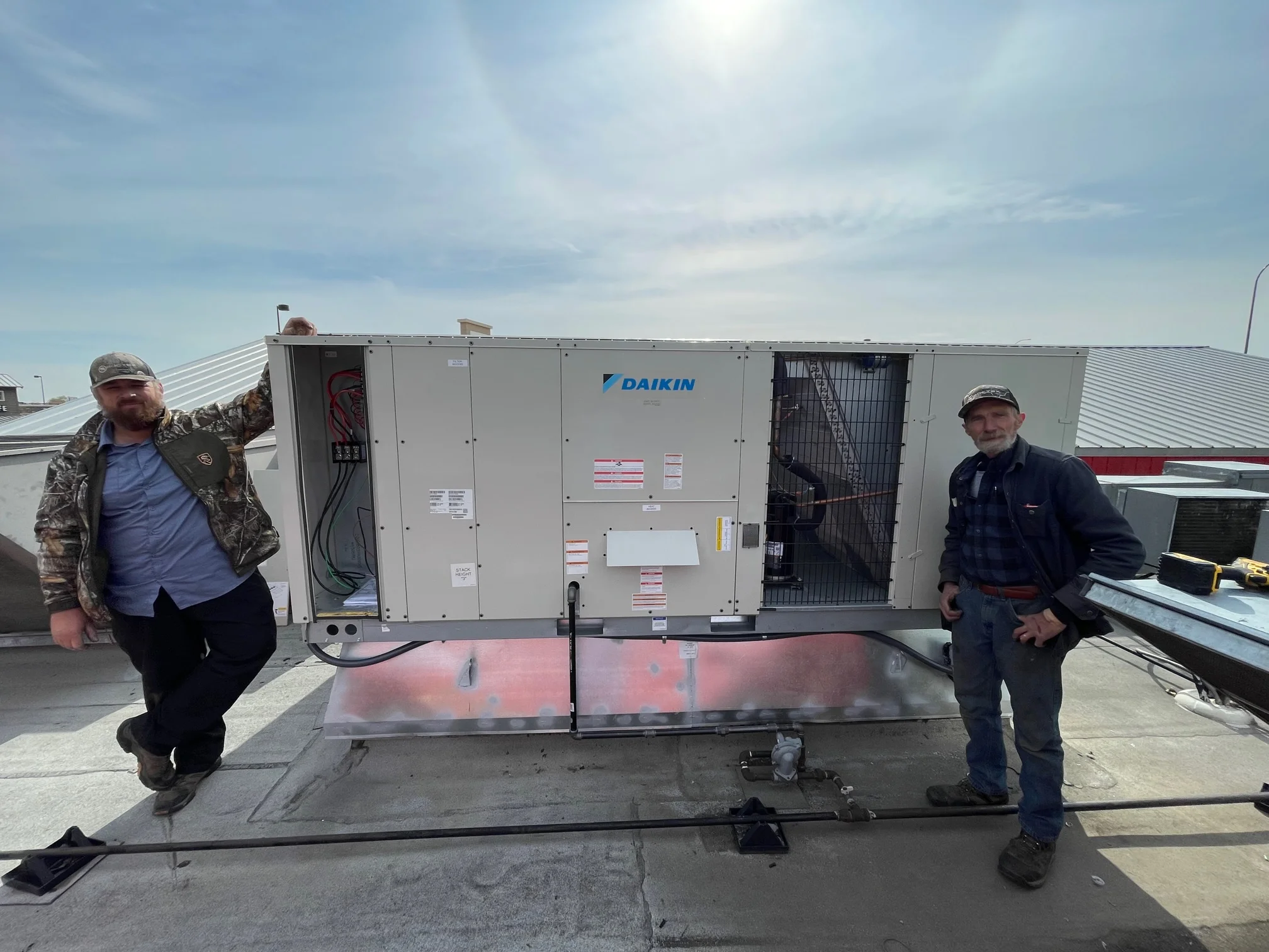 Completed installation of Daikin 15 ton commercial rooftop gas package unit in Arlington, Texas